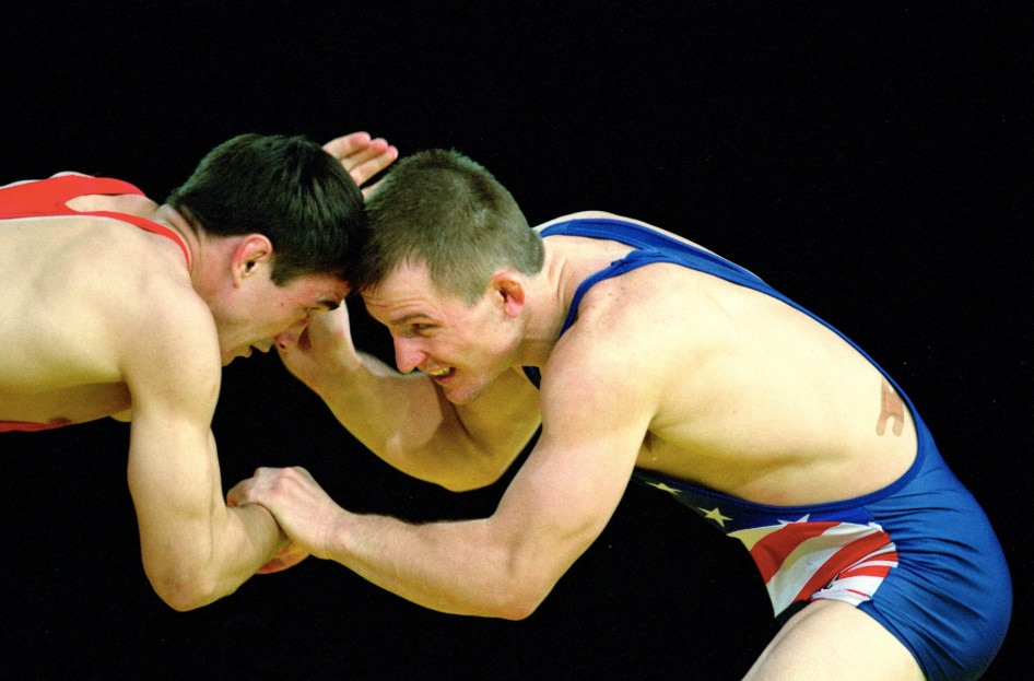 Cary Kolat (Blue) wrestles against his opponent in the 63KG Division at the 2000 Sydney Olympics. 