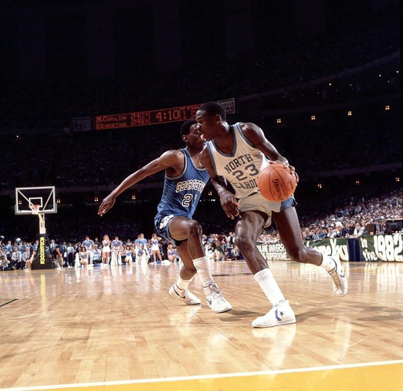 Michael Jordan drives against Eric Floyd during the 1982 NCAA title game in New Orleans.