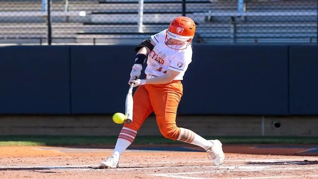 JT Smith slugs a home run in DII softball. 