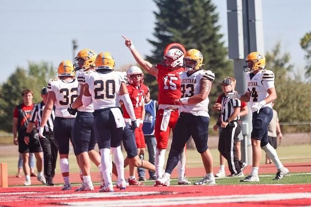 Jack Strand points for another first down.