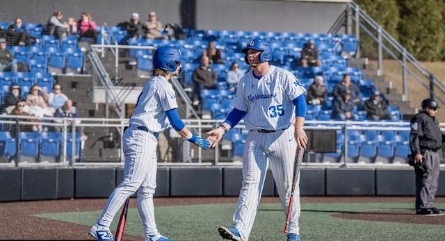 North Georgia gives high fives after another DII baseball series win.